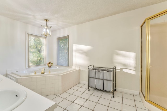 432 Castle Rd, Dalton, GA 30720 - bathroom with vanity, separate shower and tub, a notable chandelier, tile patterned floors, and a textured ceiling