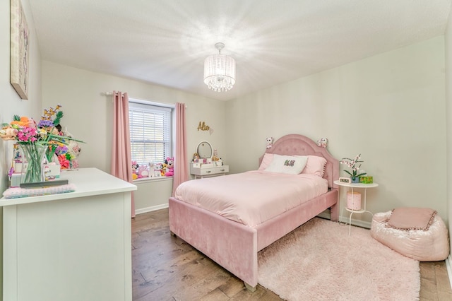 432 Castle Rd, Dalton, GA 30720 - bedroom with an inviting chandelier, light hardwood / wood-style flooring, and a textured ceiling