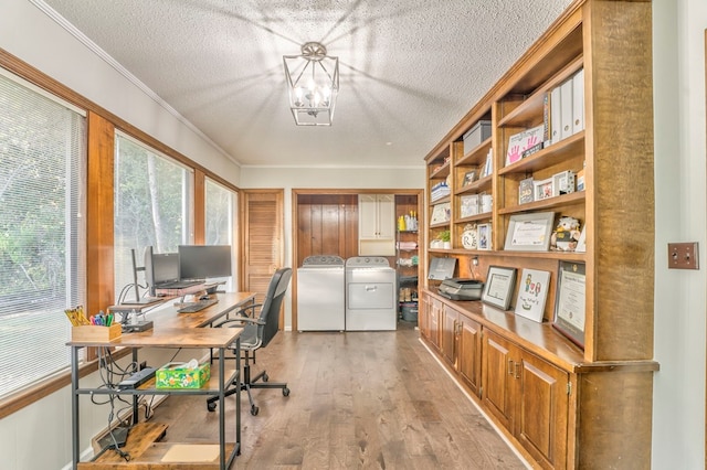 432 Castle Rd, Dalton, GA 30720 - home office featuring crown molding, a textured ceiling, light hardwood / wood-style floors, and washing machine and clothes dryer