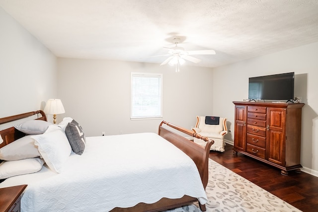 103 Paddle Wheel Ct, Cohutta, GA 30720 - bedroom with dark wood finished floors, ceiling fan, and baseboards