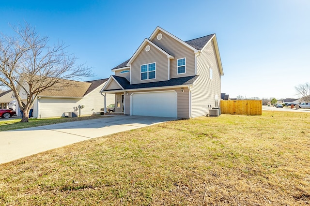 view of front of home with a garage, central AC, and a front lawn