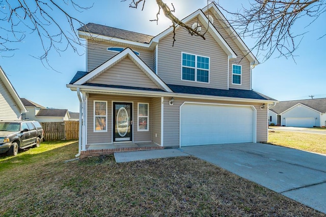 view of front of property featuring a garage and a front yard