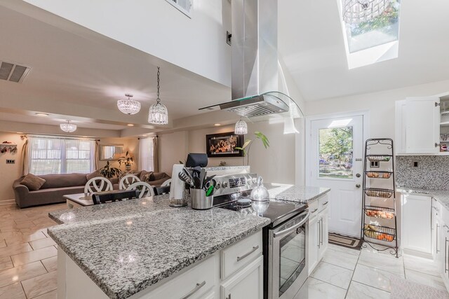 kitchen featuring island range hood, a center island, stainless steel electric stove, light stone countertops, and white cabinets