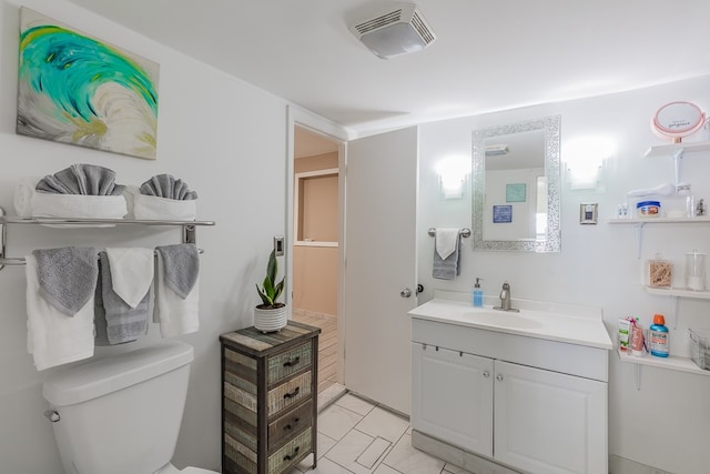 bathroom with vanity and toilet