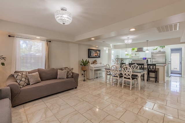 living room featuring a chandelier