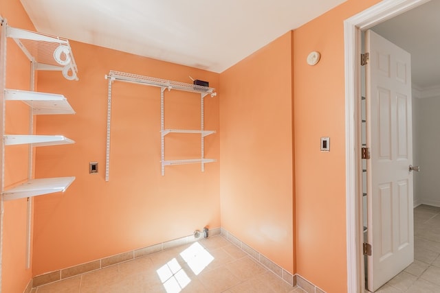 laundry area featuring light tile patterned floors