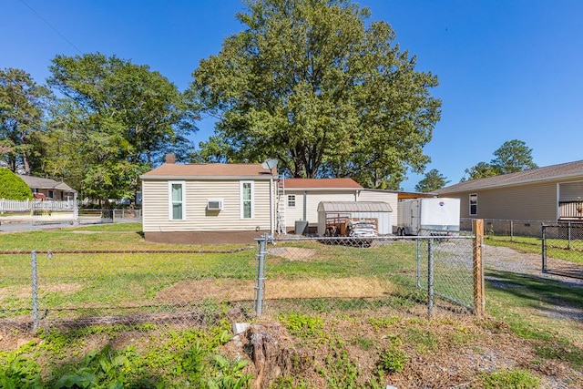 back of property featuring a yard