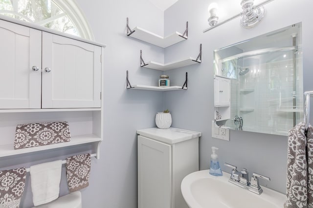 bathroom with sink and walk in shower