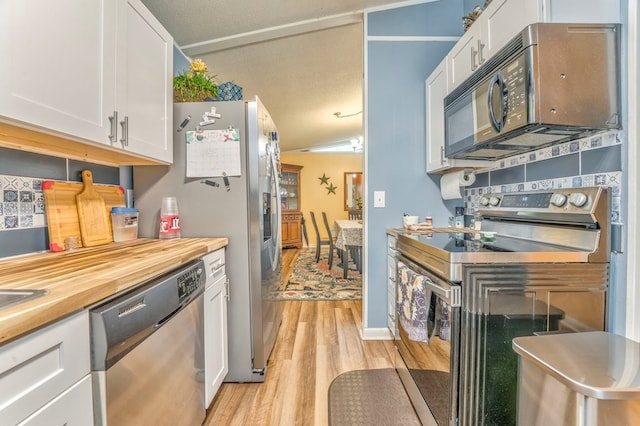 1164 Holly Grove Cir, Dalton, GA 30720 - kitchen featuring wooden counters, light wood-style floors, stainless steel appliances, and white cabinets
