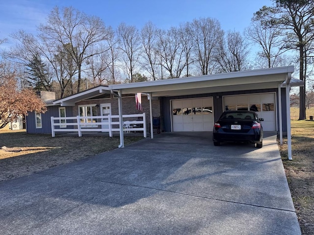 view of front of property featuring an attached garage and driveway