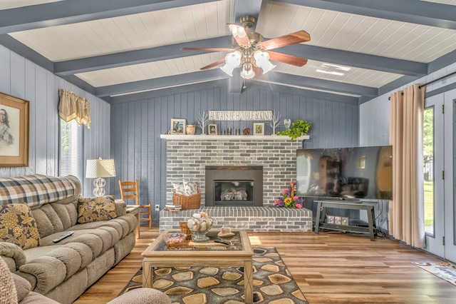 1164 Holly Grove Cir, Dalton, GA 30720 - living area featuring wood walls, a fireplace, plenty of natural light, and wood finished floors