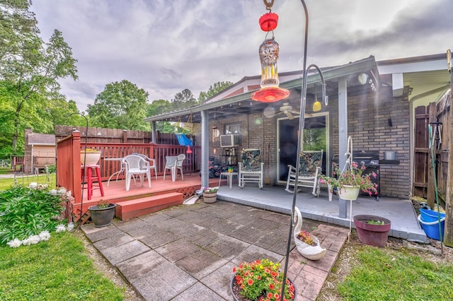 1164 Holly Grove Cir, Dalton, GA 30720 - exterior space featuring brick siding, a patio, fence, and a deck