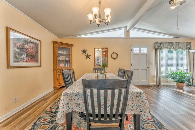 1164 Holly Grove Cir, Dalton, GA 30720 - dining space with baseboards, a chandelier, light wood-style flooring, and lofted ceiling with beams