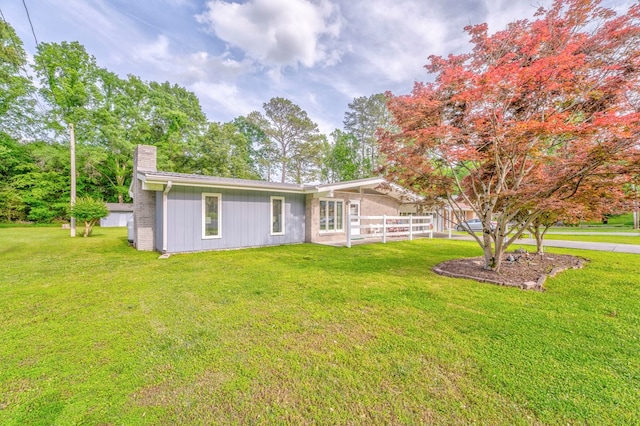 1164 Holly Grove Cir, Dalton, GA 30720 - view of front facade featuring a chimney, a front yard, and fence