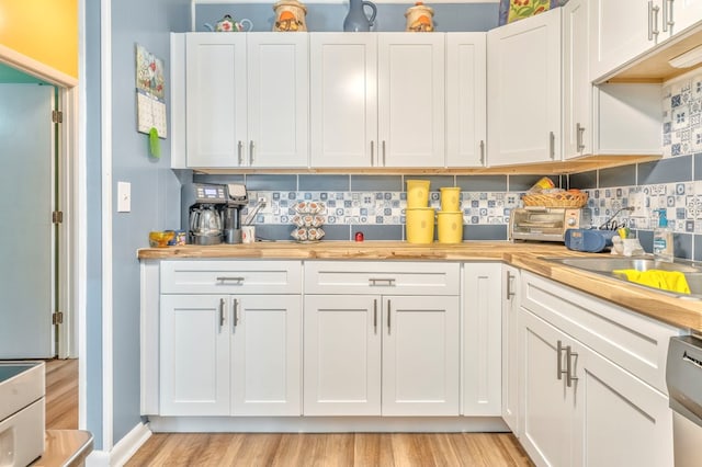 1164 Holly Grove Cir, Dalton, GA 30720 - kitchen featuring white cabinets, light wood-type flooring, and backsplash