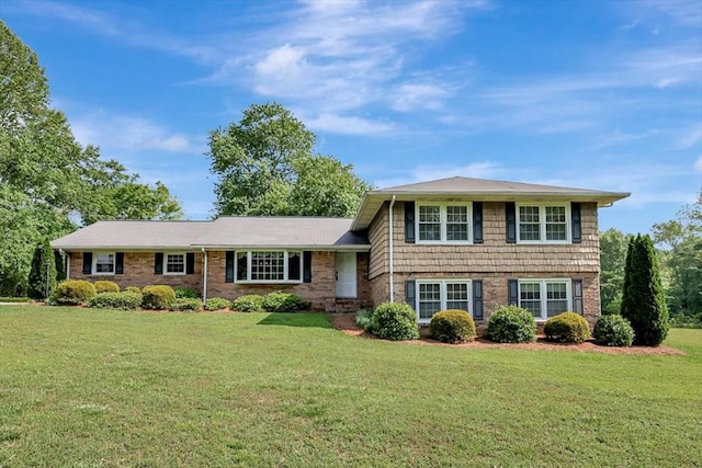 153 Buckingham Dr, Dalton, GA 30720 - tri-level home with a front lawn and brick siding