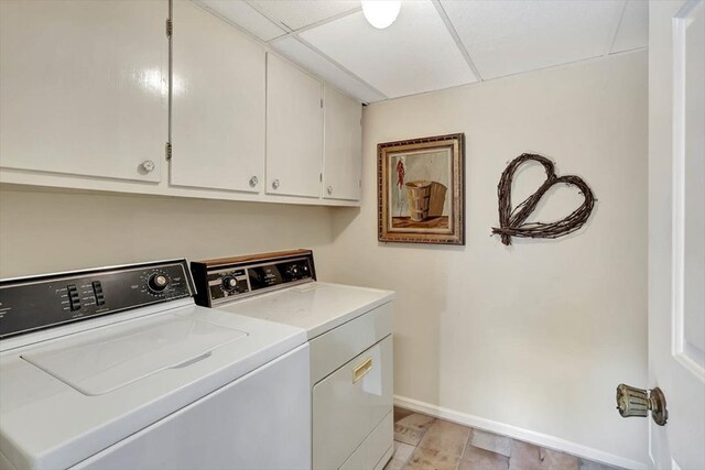 153 Buckingham Dr, Dalton, GA 30720 - washroom with cabinet space, washer and dryer, and baseboards