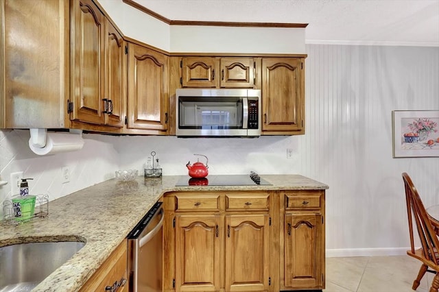 153 Buckingham Dr, Dalton, GA 30720 - kitchen with appliances with stainless steel finishes, brown cabinets, light stone counters, and ornamental molding