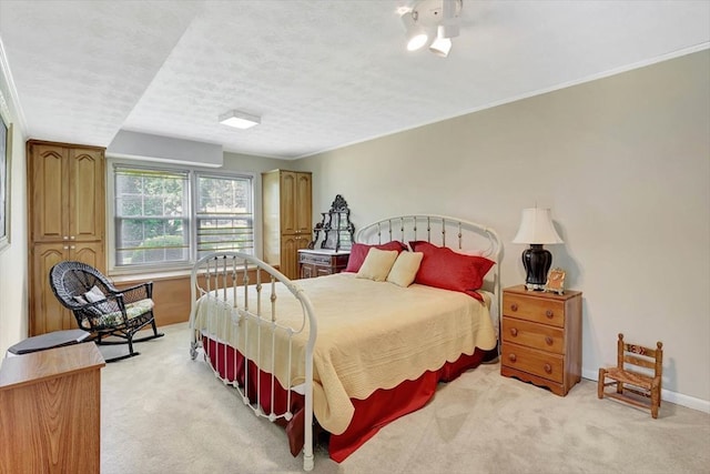 153 Buckingham Dr, Dalton, GA 30720 - bedroom featuring light carpet, a textured ceiling, and baseboards
