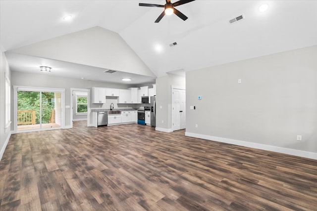 unfurnished living room with sink, high vaulted ceiling, dark hardwood / wood-style floors, and ceiling fan