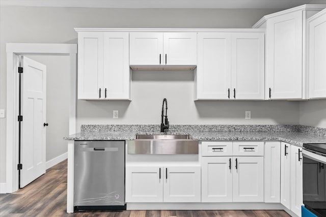 kitchen with dark wood-type flooring, sink, appliances with stainless steel finishes, light stone countertops, and white cabinets