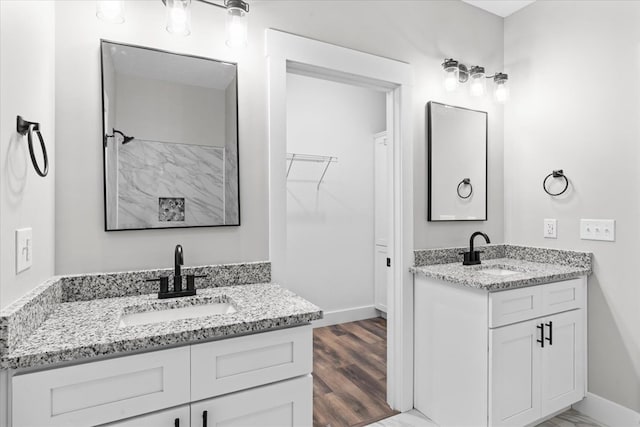 bathroom featuring vanity and hardwood / wood-style flooring