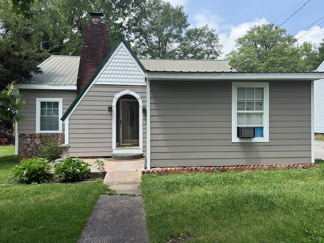 406 Lester Ave, Dalton, GA 30721 - view of front of home featuring a chimney, a front lawn, and metal roof