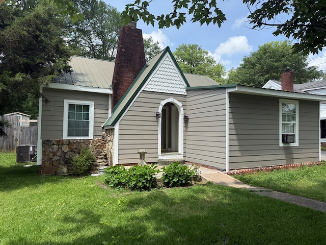 406 Lester Ave, Dalton, GA 30721 - view of front of property with a chimney, metal roof, cooling unit, and stone siding