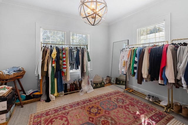 spacious closet featuring a notable chandelier and carpet floors