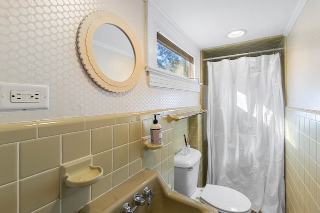 bathroom with toilet and tile walls