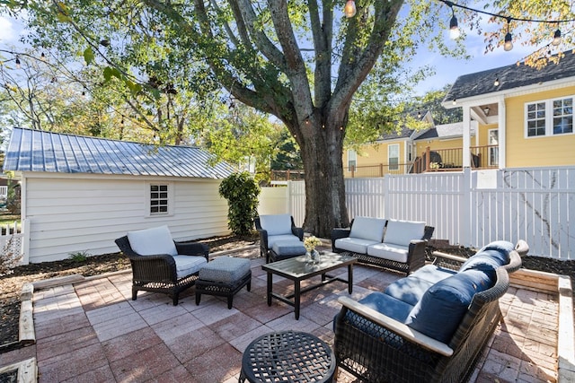 view of patio / terrace with an outdoor structure and an outdoor hangout area