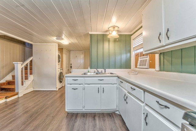 282 Cedar Ridge Rd, Dalton, GA 30721 - kitchen featuring light countertops, wooden ceiling, stacked washer / drying machine, a sink, and wood finished floors