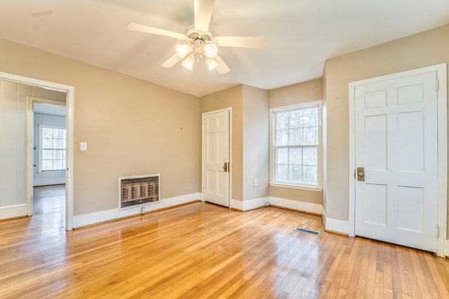 282 Cedar Ridge Rd, Dalton, GA 30721 - empty room with heating unit, baseboards, visible vents, light wood-style floors, and ceiling fan