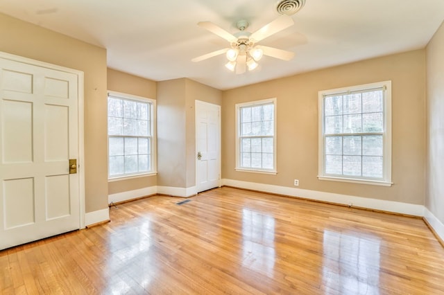 282 Cedar Ridge Rd, Dalton, GA 30721 - interior space featuring multiple windows, baseboards, light wood-style floors, and visible vents