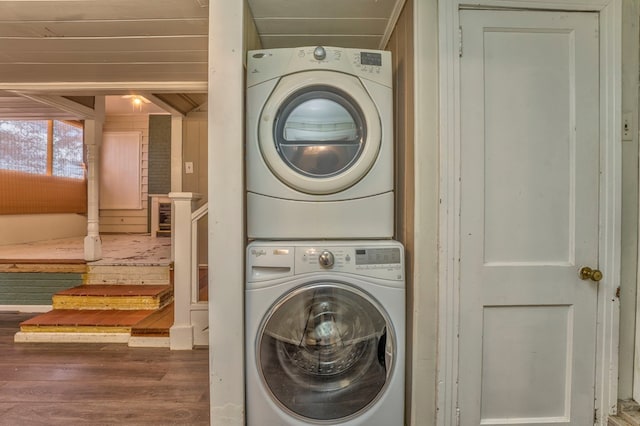 282 Cedar Ridge Rd, Dalton, GA 30721 - clothes washing area with wood finished floors, stacked washing maching and dryer, and laundry area