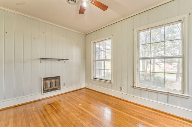 282 Cedar Ridge Rd, Dalton, GA 30721 - unfurnished living room with crown molding, hardwood / wood-style flooring, heating unit, a ceiling fan, and a fireplace