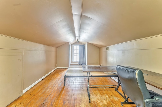 282 Cedar Ridge Rd, Dalton, GA 30721 - unfurnished office featuring lofted ceiling, visible vents, and hardwood / wood-style flooring