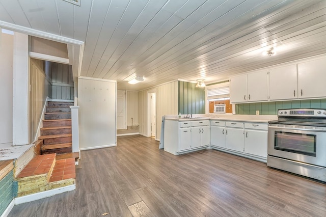282 Cedar Ridge Rd, Dalton, GA 30721 - kitchen with light countertops, wooden ceiling, wood finished floors, white cabinets, and electric range