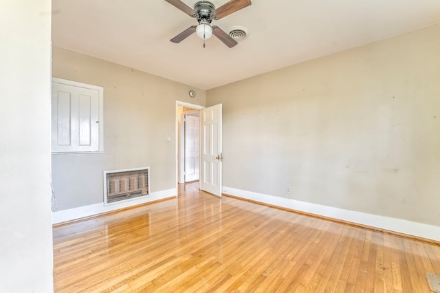 282 Cedar Ridge Rd, Dalton, GA 30721 - empty room with baseboards, light wood-style floors, ceiling fan, heating unit, and visible vents