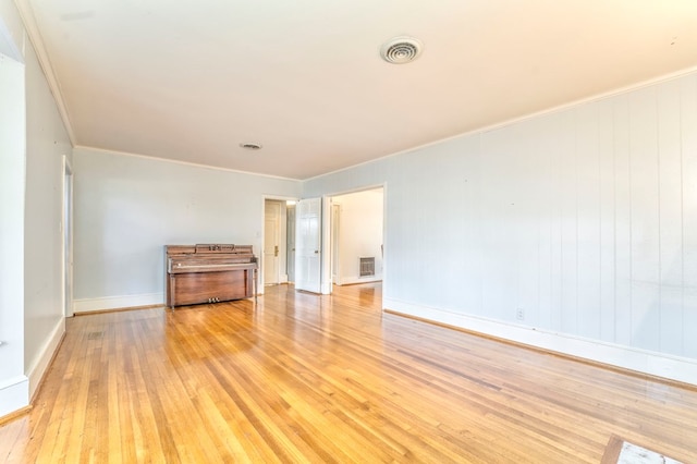 282 Cedar Ridge Rd, Dalton, GA 30721 - spare room featuring ornamental molding, baseboards, light wood finished floors, and visible vents