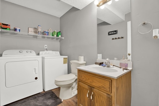 478 Dedmon Rd, Ringgold, GA 30736 - bathroom featuring washer and dryer, vanity, and wood finished floors