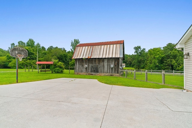 662 Nance Springs Rd, Dalton, GA 30721 - view of patio featuring a barn, an outdoor structure, and basketball court
