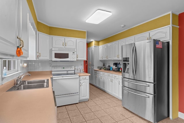 662 Nance Springs Rd, Dalton, GA 30721 - kitchen featuring white appliances, white cabinets, backsplash, light tile patterned floors, and ornamental molding