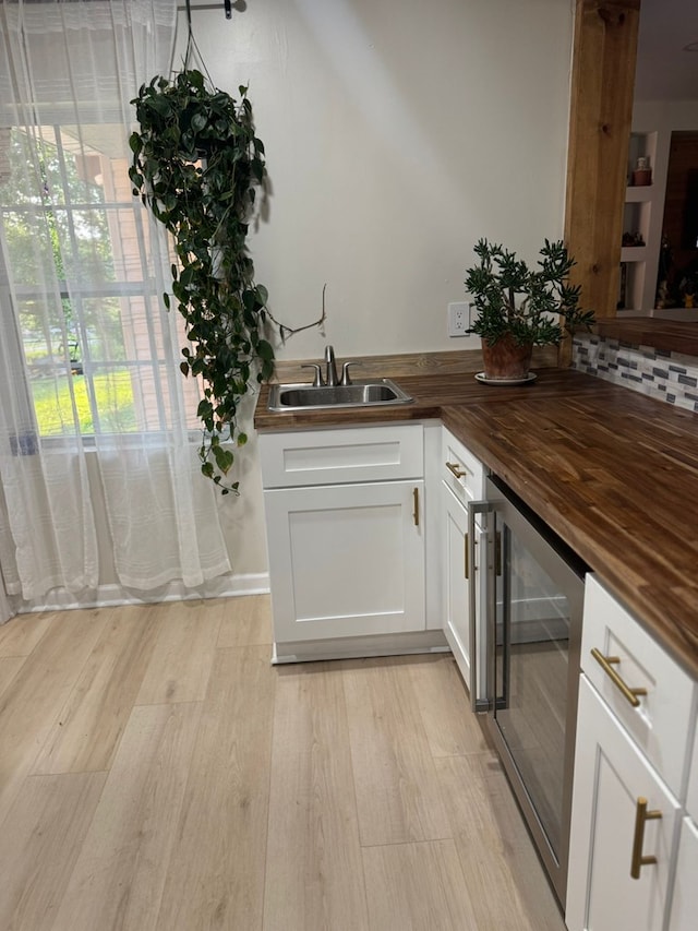 999 Norton Bridge Rd, Chatsworth, GA 30705 - indoor bar with wine cooler, light wood-style floors, and backsplash