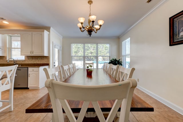 dining space featuring light tile patterned floors, crown molding, and a wealth of natural light