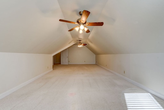 bonus room featuring vaulted ceiling and light carpet