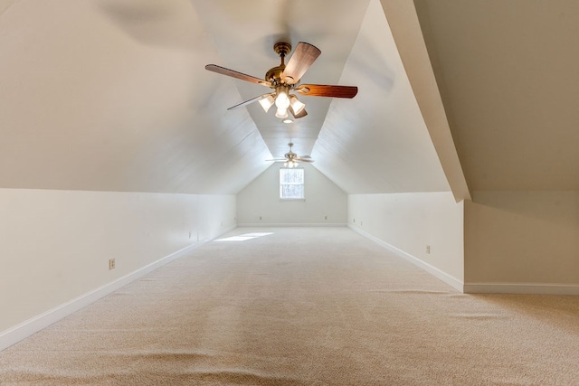 additional living space with vaulted ceiling and carpet