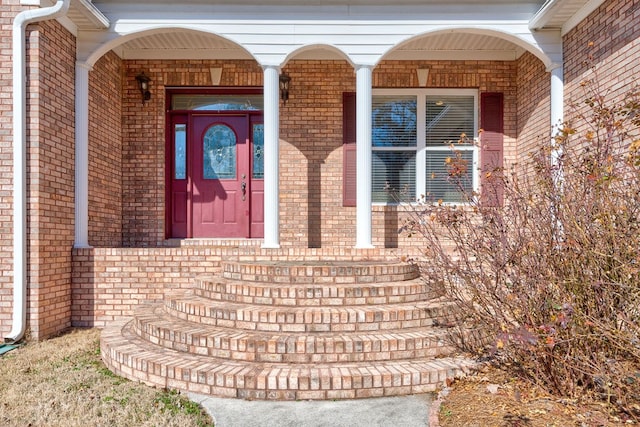 view of exterior entry with covered porch