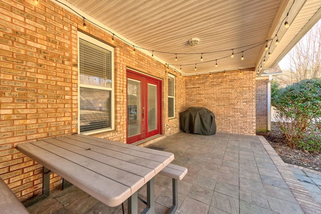 view of patio with a grill and french doors