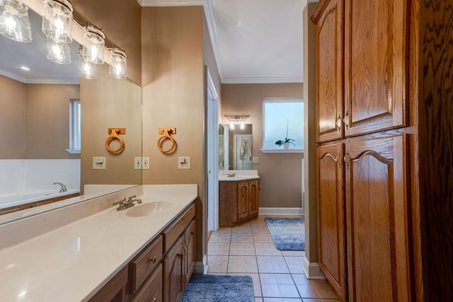 bathroom with tile patterned flooring, crown molding, vanity, and a tub to relax in